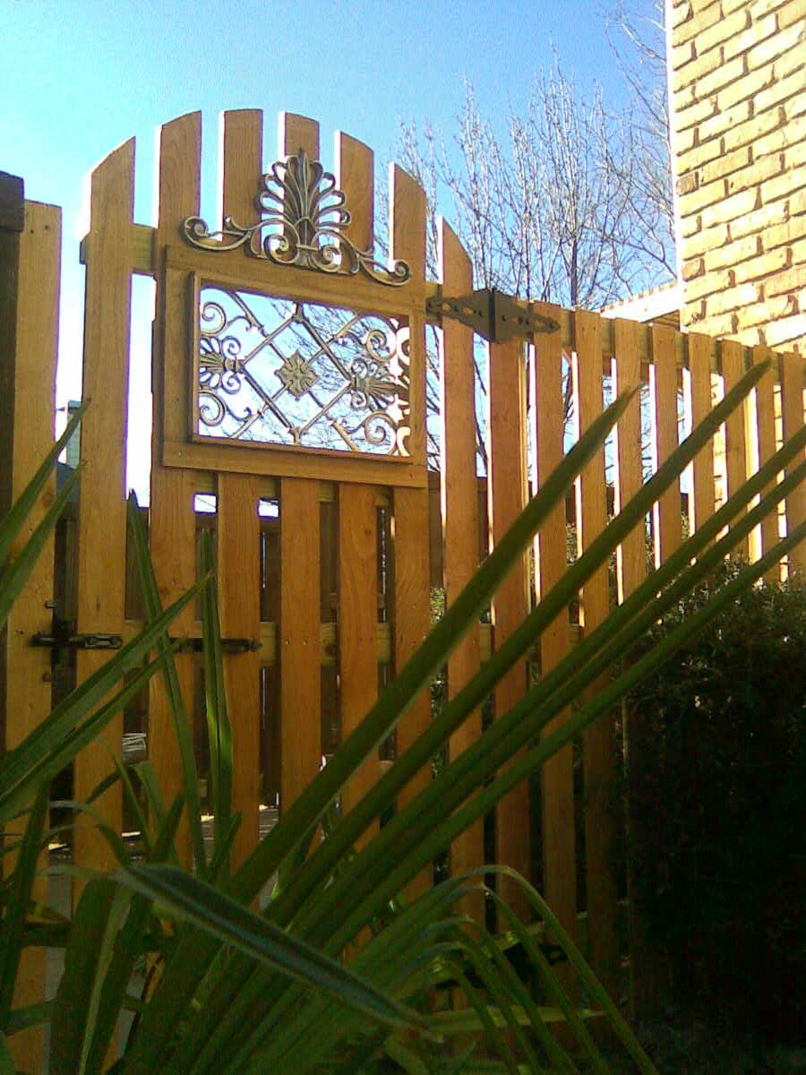 10. PicketSpacePicket Fence with Custom Cast Aluminum Insets Fences